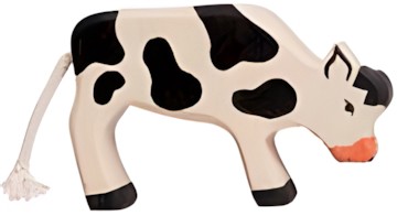 Holztiger Kalb grasend schwarz Holztiger Kalb grasend schwarz